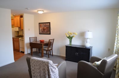 Cozy resident room with seating and dining area