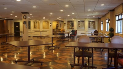 Interior view of a common area with tables and chairs