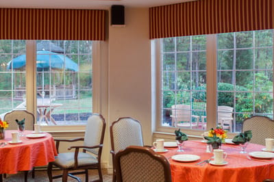 Bright dining area with tables set for meals