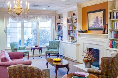 Cozy common area with seating and bookshelves