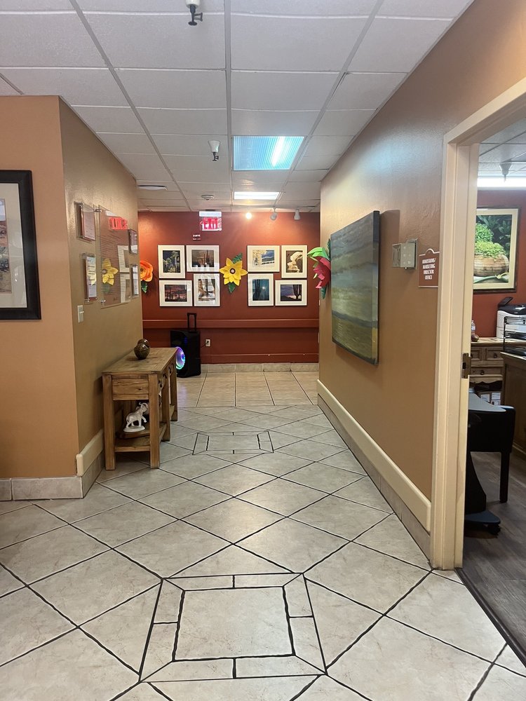 Interior hallway with framed photos and decor