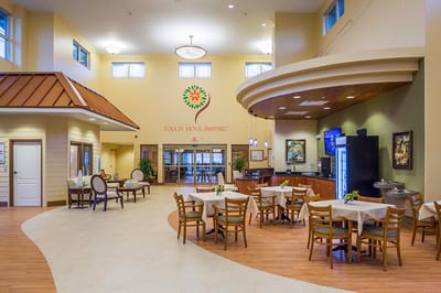 Bright dining area with tables and chairs