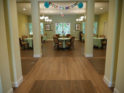 Bright common area with dining tables and decor
