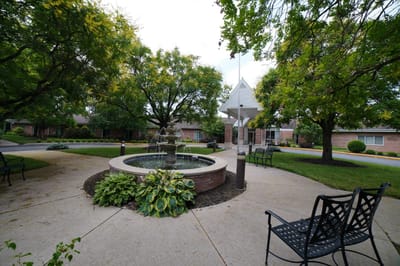 Patio area with a fountain and seating