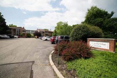 Exterior view of St. Paul Village with parking