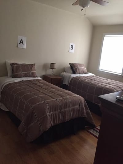 Two twin beds in a private resident room