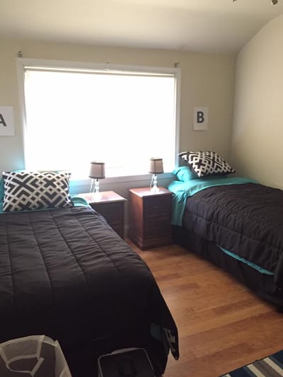 Private resident room with two beds and decor