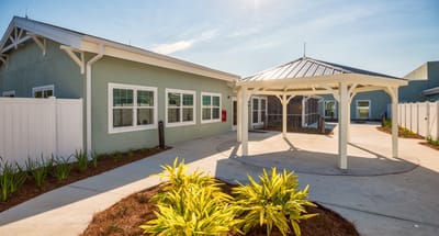 Exterior view of a building entrance with landscaping
