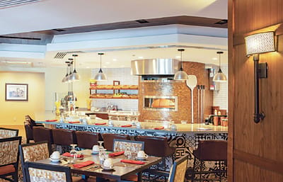 Interior view of a dining area with a pizza oven