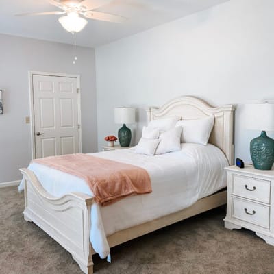 Cozy bedroom with a large bed and decorative lamps