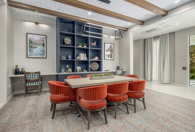 Bright common area with seating and shelves