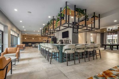 Modern common area with seating and greenery