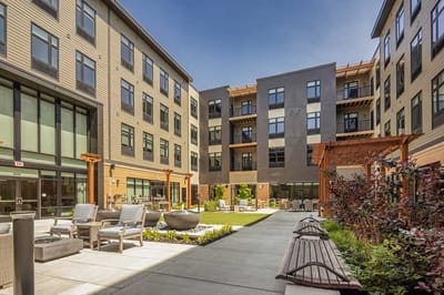 Outdoor courtyard with seating and landscaping