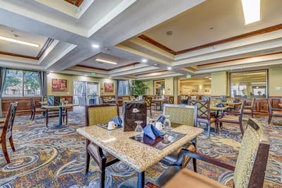 Bright and spacious dining area with tables and decor