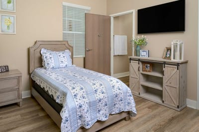 Cozy resident room with a bed and furniture