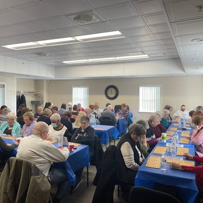 Residents participating in a bingo game in a common area