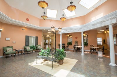Interior view of a well-lit common area with seating