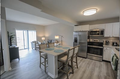 Bright and modern kitchen and living area in a senior apartment