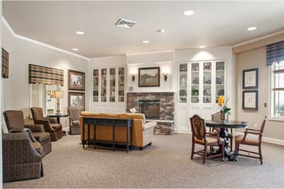 Common area in a senior living facility with seating and decor