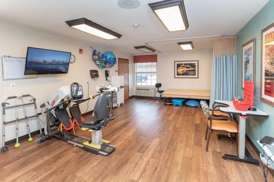 Interior view of a therapy room with exercise equipment