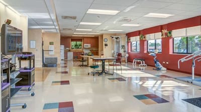 Bright therapy room with exercise equipment