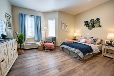 Cozy resident room with a comfortable bed and decor