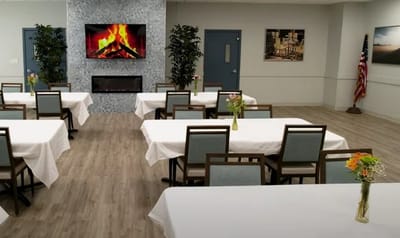 Dining area with tables set for residents