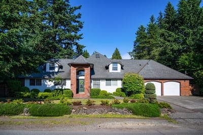 Exterior view of a residential building with landscaped garden