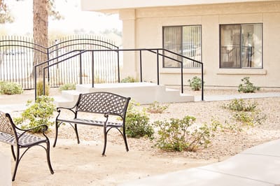 Outdoor seating area with benches and landscaping