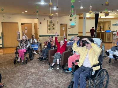 Residents participating in a cheerful group activity