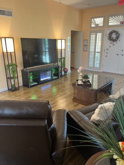 Comfortable common area with seating and television
