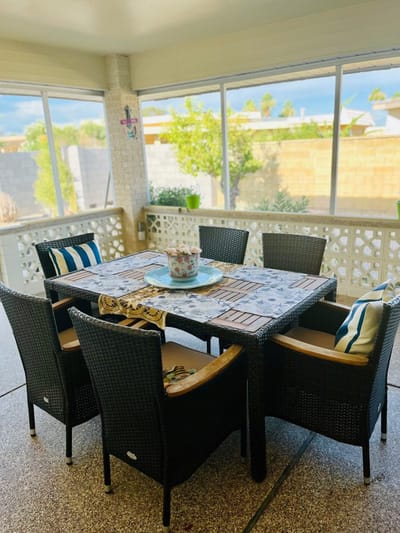 Outdoor dining area with chairs and table