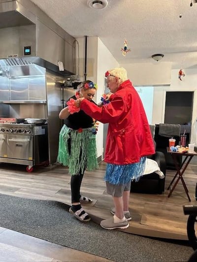 Residents participating in a festive activity in the common area