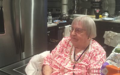 Senior resident in a cozy kitchen setting