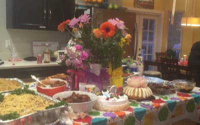 Table with food and flowers in a dining area