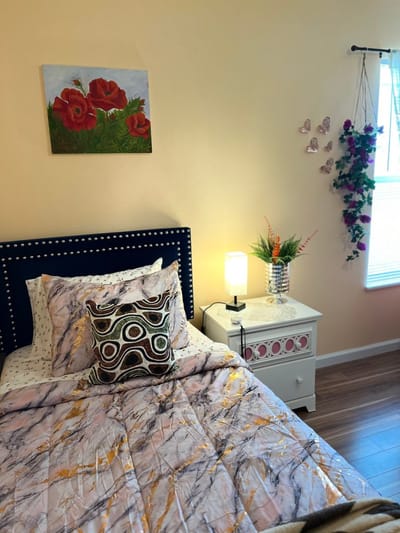 Cozy well-decorated resident room with flowers