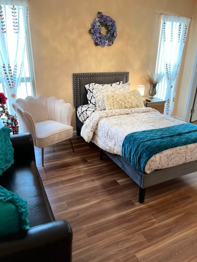 A cozy bedroom set up in a senior living facility