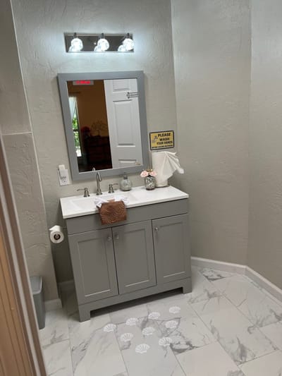 Interior view of a facility bathroom with a sink