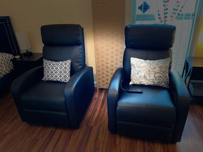 Cozy seating area with two armchairs and decorative pillows