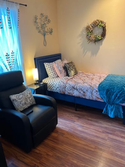 Cozy private resident room with decorated bed
