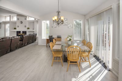 Bright dining area with large windows and a table