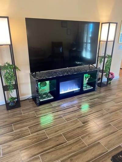 A cozy living area with a TV and decorations