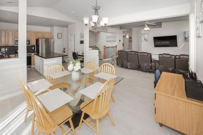 Bright dining area with seating and living space