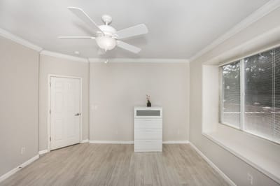 Bright private room with a window and furniture