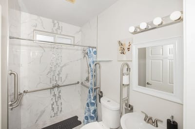 Accessible bathroom with grab bars and modern fixtures