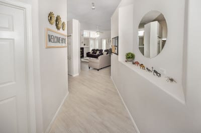 Bright hallway leading to a living area within the facility