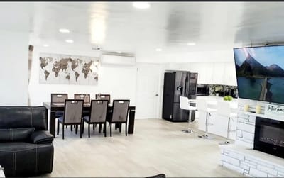 Bright common area with dining and living spaces