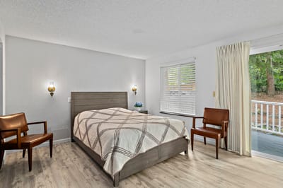 Private resident room with a bed and chairs