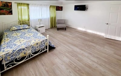 Cozy single resident room with a floral bedspread