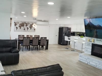 Bright common area with dining and lounge space